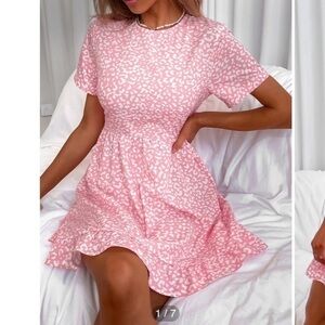 Get your babe is on in this Pink animal print ruffle dress